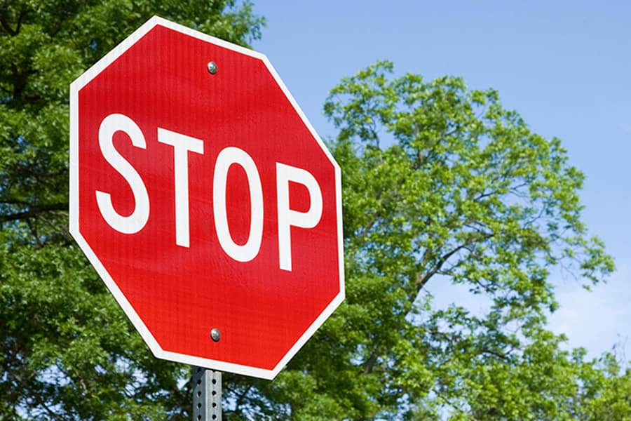 Until the 50s, stop signs were what color?