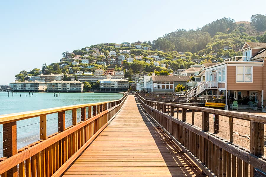 Sausalito is a town located directly across from which Californian city?