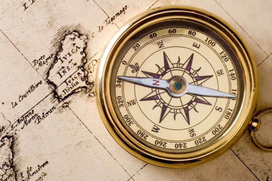 Which direction does a compass needle point?