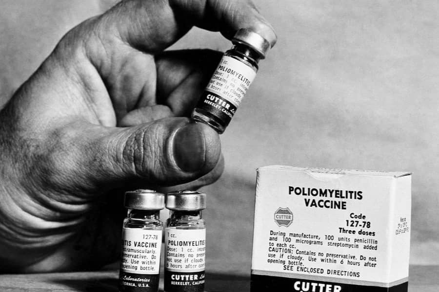 Which scientist developed the polio vaccine first widely used in 1955?