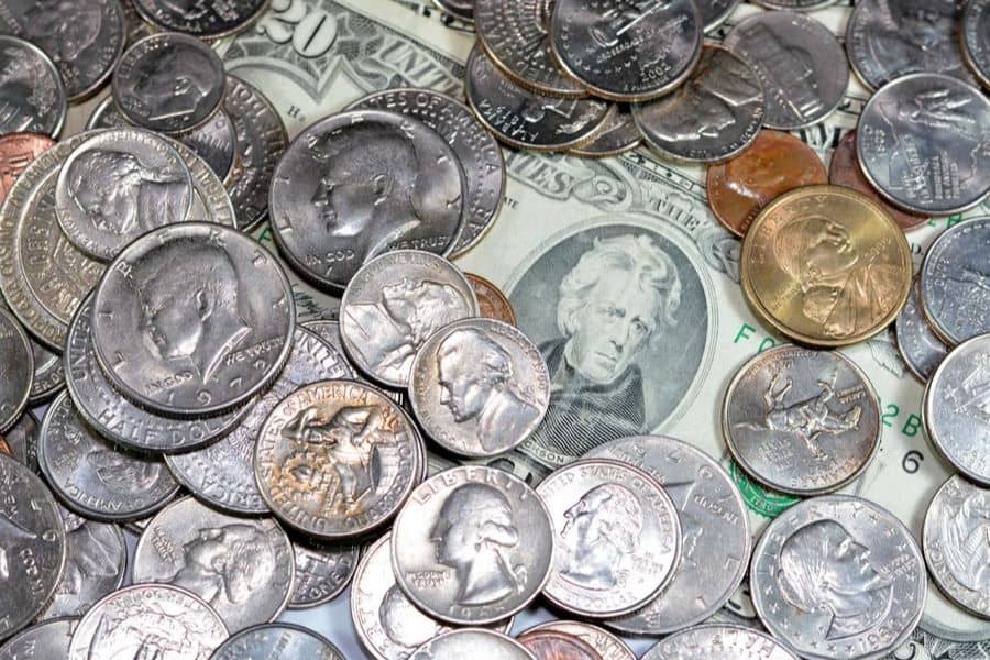 Which U.S. coin was the first to feature the portrait of a real person?