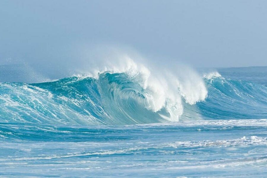 Which phenomenon causes tides on Earth?